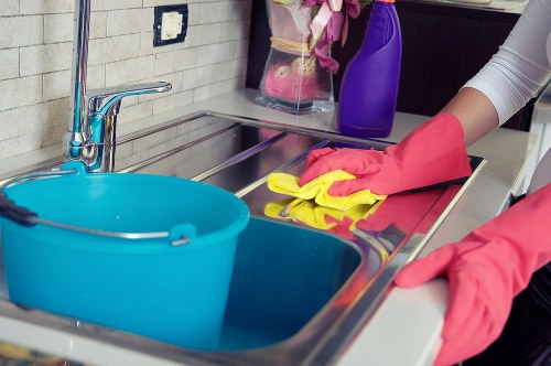 Cleaner wearing PPE during a safe cleaning task